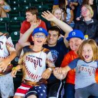 Photo of a family with Detroit Tigers jerseys cheering in the audience pt. 2